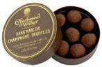 Charbonnel et Walker Sticky Toffee Pudding Truffles in a round gold and black tin